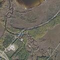 Truck submerged with boat trailer in river at Pine River boat launch