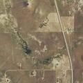 Downed power line and damaged structure on highway
