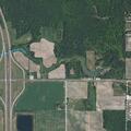 Man lying partly in ditch on M-61 near Melita Rd