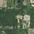 Skid steer fire reported beside pole barn in Gladwin