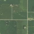 Male in tractor possibly suffering heat stroke in yard