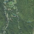 Unresponsive elderly man found breathing at road intersection