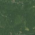 Report of erratic gray sedan near Malone