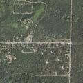 Yard fire spreading into woods in Grayling