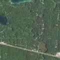 Car stuck off road in water near East Bear Lake