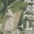Woman experiencing chest pain at industrial site