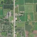 Unknown person crouching in yard in Colby