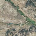 Small grass fire near structure on South Ash Creek