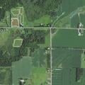 Elderly woman near river road with tight belly and breathing issues