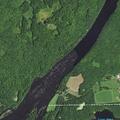 Tree top fire near farm by river in Lake Holcombe