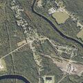 Police detain man on orange dirt bike near Milo
