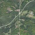 House fire spreads to woods near Shire Rd in Wilmot Township