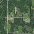 Men fight with sticks in yard near state highway