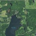 Large uncontrolled fire near cabins and trees