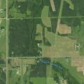 Large grass fire near trees on Kearney Road field