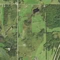 Vehicle fire in wooded area near Finlayson sheds