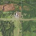 Officers pursue three people running on dirt road
