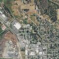 Person lying on sidewalk near North Main Street in Colville