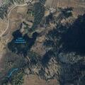 Wildland fire moves toward nearby structures