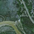 Medical responders search trail for patient near river