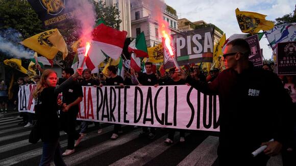 Soldiers guard center of Milan as thousands of protesters march in cities across Europe