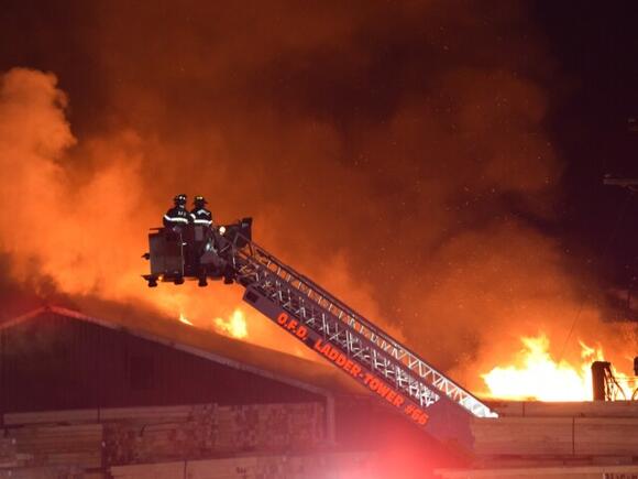 Over 20 crews battle massive fire at Wayne County lumber yard - NewsBreak