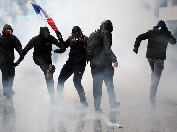 Storefronts close as police in Paris fire tear gas and water cannons on protesters