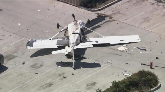Good Samaritans lift small plane to free pilot after crash into store ...