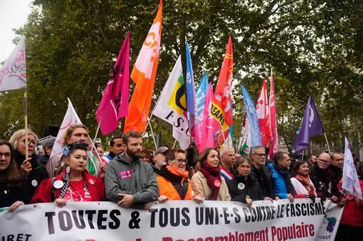 More than 400,000 protest across France, challenging Macron as Paris clashes erupt