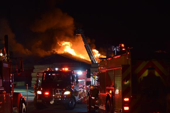 Over 20 crews battle massive fire at Wayne County lumber yard - NewsBreak