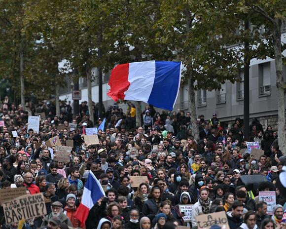 Hundreds of thousands march across France in protests over schools and policing