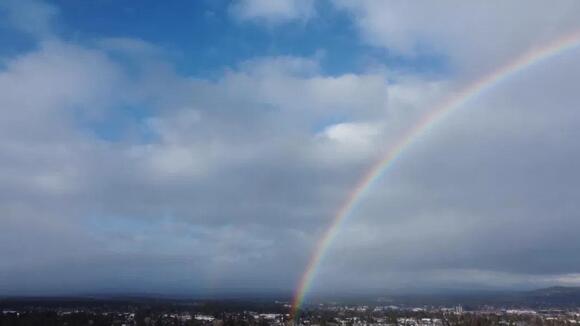 Watch: Soar through the sky as a full rainbow -even a double – arcs ...