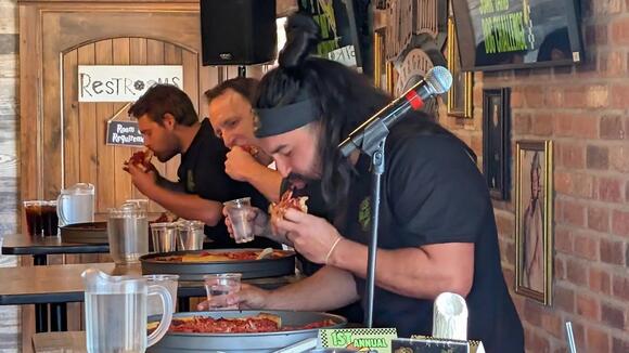 Joey Chestnut eats 8-pound pizza in just over 12 minutes - NewsBreak