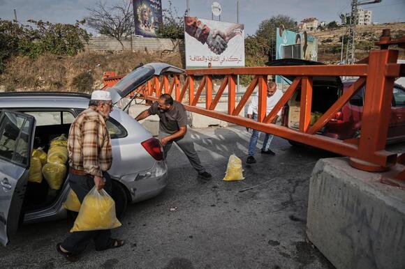 Israel imposes closures across a West Bank city after attacks, and other Mideast news