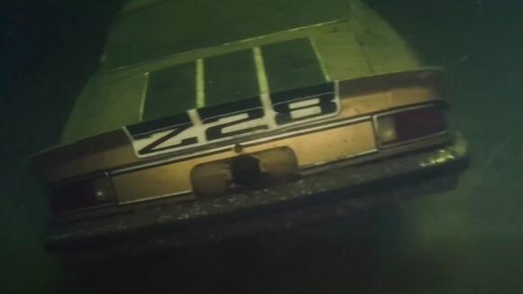 A 52-year-old sports car was found at the bottom of a lake with no ...