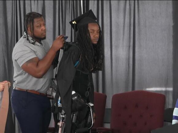 Paralyzed student walks at graduation; credits Christ and special suit ...