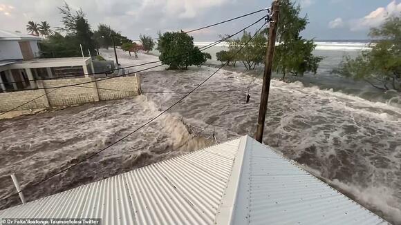 Devastating photos show tsunami raging through villages in Tonga as ...