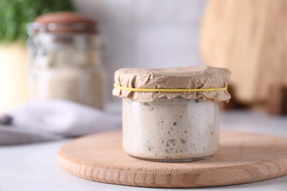 Sourdough starter is full of live bacteria, so why isn't sourdough ...