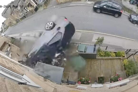 Speeding BMW smashes into row of homes before 2 occupants casually flee ...