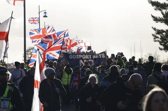 Hundreds join anti-migrant march near planned immigration removal ...