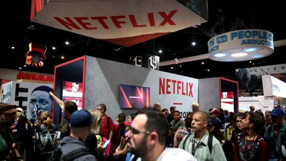 Netflix took in $12.9 billion last quarter after its 2026 price increases and says recently announced job cuts will weigh on its fourth-quarter margin