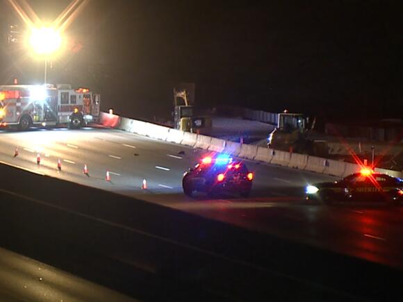 Coroner: Woman dies after being hit by semi while walking down I-71 N