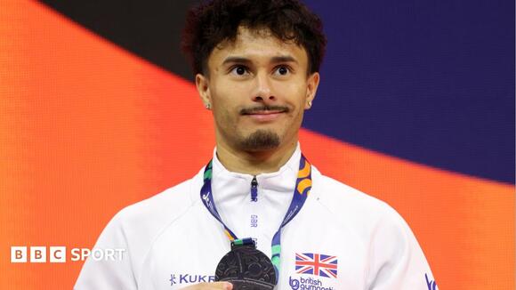 Jarman wins historic men's floor silver at worlds
