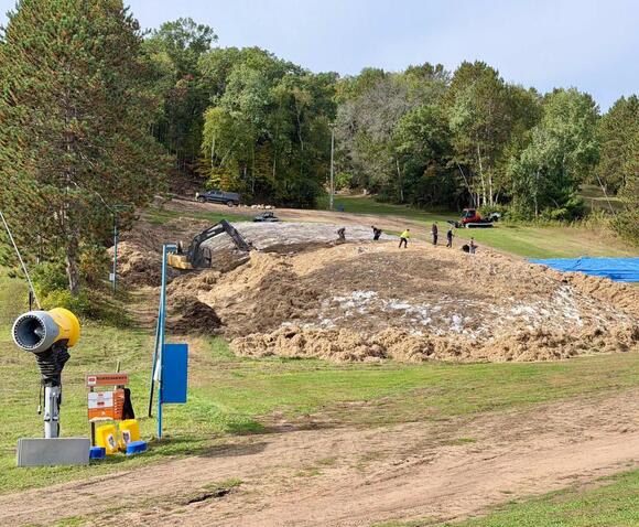 [PHOTOS] Trollhaugen, WI, Uncovers Snow Saved from Last Season for This ...