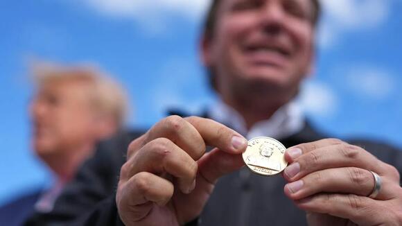 DeSantis gifts Trump gold coin with engraved image of him ‘flipping the bird’