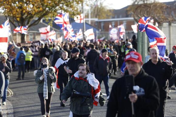 Hundreds join anti-migrant march near planned immigration removal ...