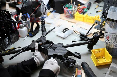 German business activity growth softens in October, PMI shows
