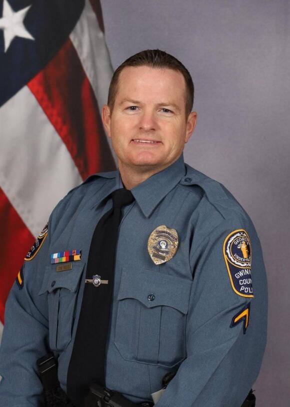One officer killed, another wounded in suburban Atlanta hotel shooting ...