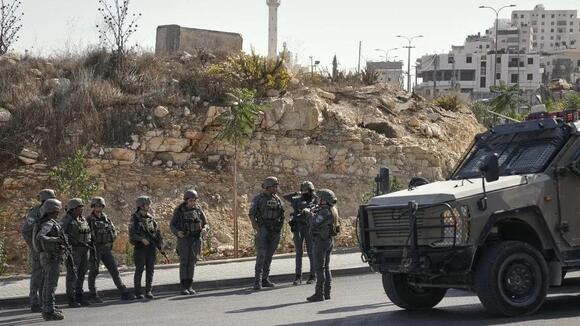 Israeli forces lock down Hebron, displace up to 2,200 after attack kills 2 soldiers