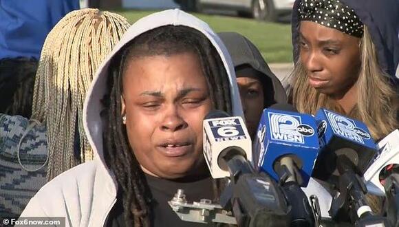 Family of black man shot dead by police officer after pulling gun says ...